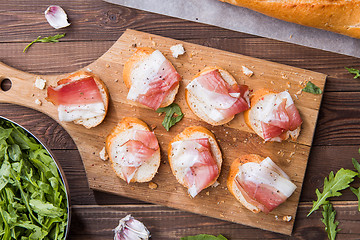 Image showing Baguette with bacon with arugula