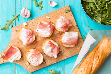 Image showing Sandwiches with bacon on table