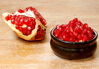 Image showing broken ripe pomegranate fruit and seeds