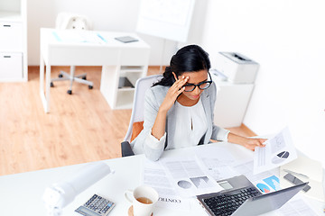 Image showing businesswoman with laptop working at office