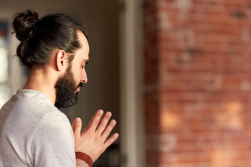 Image showing close up of man meditating at yoga studio