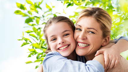 Image showing happy family of girl and mother hugging