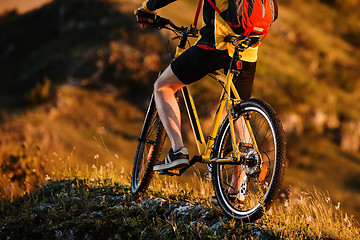 Image showing Sporty Man Riding a Bicycle on the Country Road.