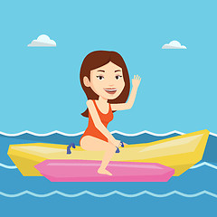 Image showing Tourists riding a banana boat vector illustration.