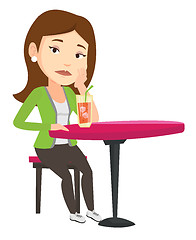 Image showing Woman drinking cocktail at the bar.