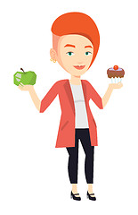 Image showing Woman choosing between apple and cupcake.