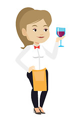 Image showing Bartender holding a glass of wine in hand.