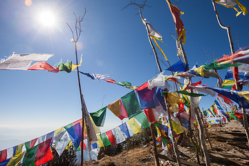 Image showing Buddhist prayer flags on a mountaintop in the Himalayas