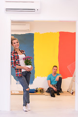 Image showing happy young couple doing home renovations