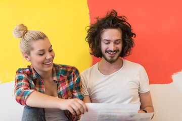 Image showing Happy young couple relaxing after painting