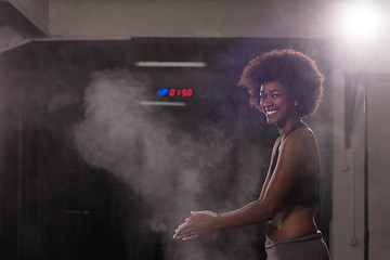 Image showing black woman preparing for climbing workout