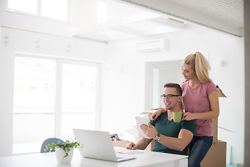 Image showing Young couple moving in a new home