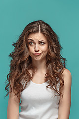 Image showing The young woman\'s portrait with thoughtful emotions