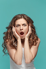 Image showing Portrait of young woman with shocked facial expression