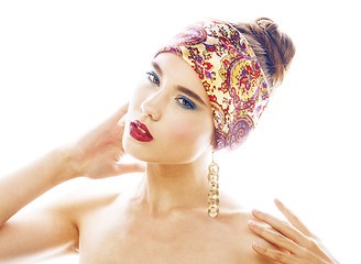 Image showing young pretty modern girl with bright shawl on head emotional posing isolated on white background, asian people ethnicity