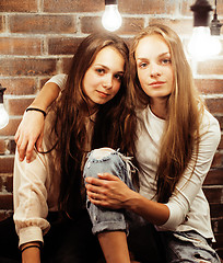 Image showing best friends teenage girls together having fun, posing emotional on white background, besties happy smiling, lifestyle people concept 