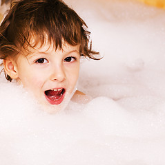 Image showing little cute boy in bathroom with bubbles close up smiling, lifestyle real people concept