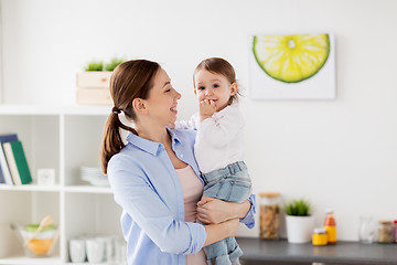 Image showing happy mother and little baby girl at home kitchen