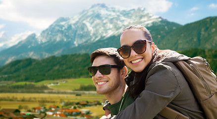 Image showing happy couple with backpacks traveling in highlands