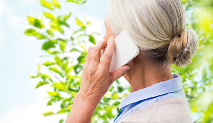 Image showing close up of senior woman calling on smartphone