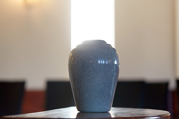 Image showing cremation urn on table in church