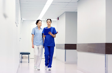 Image showing two medics or nurses at hospital with clipboard