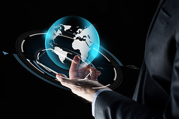 Image showing businessman hand with smartphone and earth