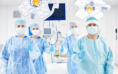 Image showing group of surgeons in operating room at hospital