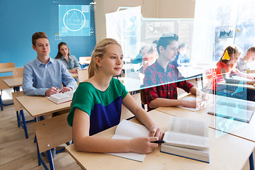 Image showing group of students with books at school lesson