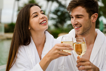 Image showing Young couple tasting wine