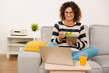 Image showing Beautiful woman eating a salad