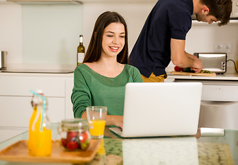 Image showing Young couple on the kitchen