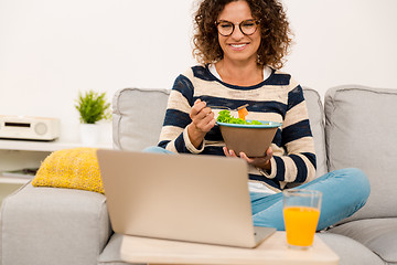 Image showing Beautiful woman eating a salad