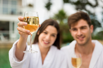 Image showing Young couple tasting wine