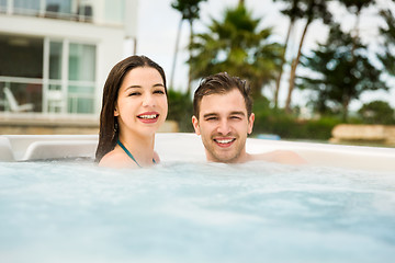 Image showing Young couple in a jacuzzi