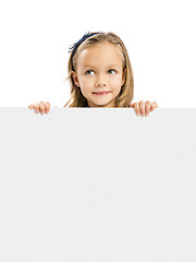 Image showing Cute Girl holding a whiteboard