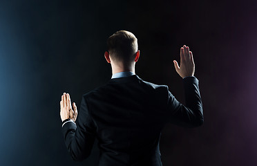 Image showing businessman touching something invisible