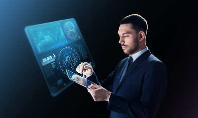 Image showing businessman in suit with transparent tablet pc