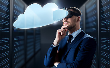 Image showing businessman in virtual reality headset with cloud