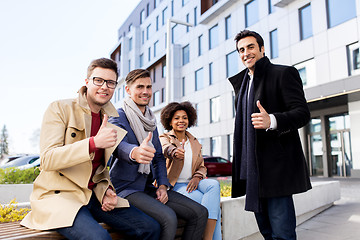 Image showing international business team showing thumbs up