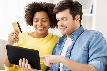 Image showing couple with tablet pc and credit card at home