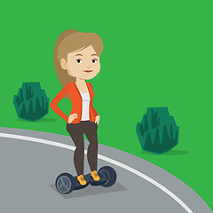 Image showing Woman riding on self-balancing electric scooter.