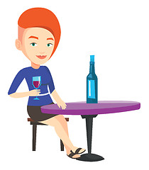 Image showing Woman drinking wine at restaurant.
