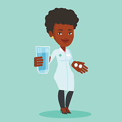 Image showing Pharmacist giving pills and glass of water.