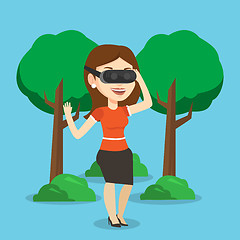 Image showing Woman wearing virtual reality headset in the park.