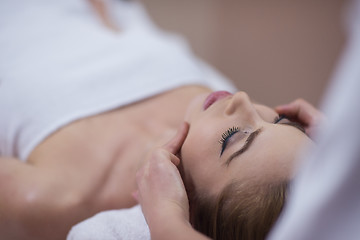 Image showing woman receiving a head massage