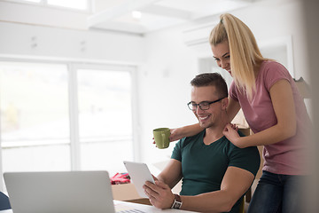 Image showing Young couple moving in a new home