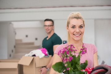 Image showing young couple moving into a new home