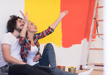 Image showing Happy young couple relaxing after painting