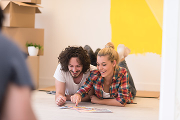 Image showing Happy young couple relaxing after painting